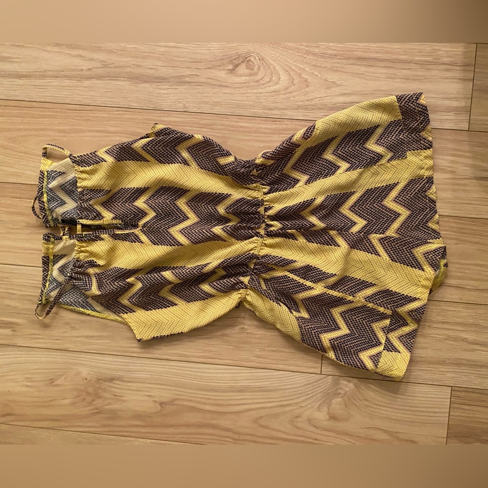 Small yellow romper with pockets